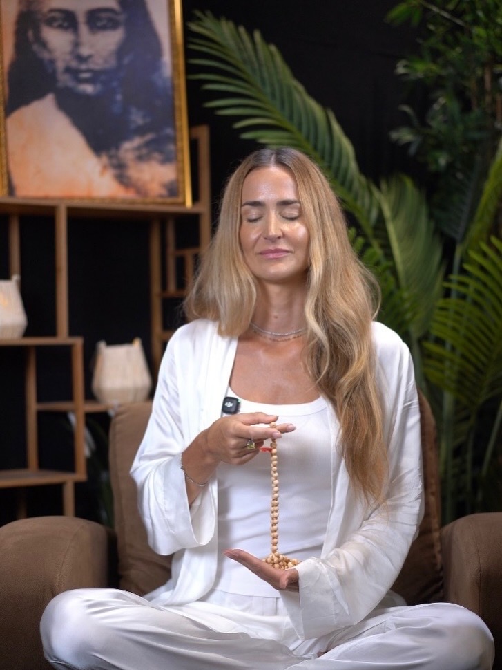 Annie Winger meditating with prayer beads